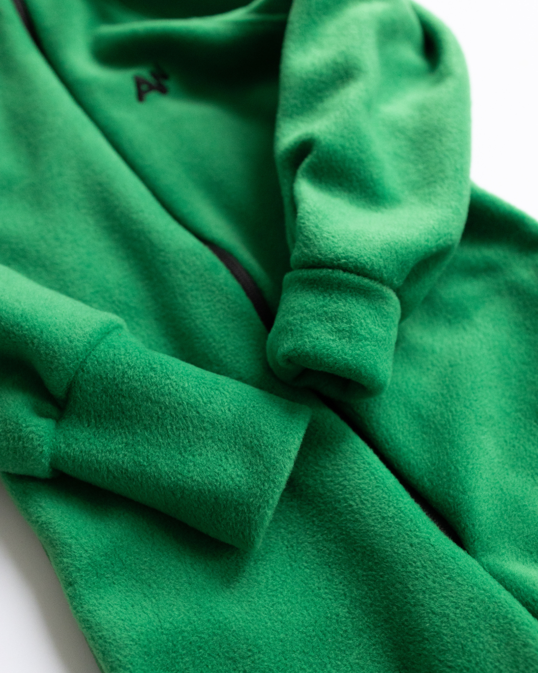Rolled cuffs on green fleece kids overall – grows with your child