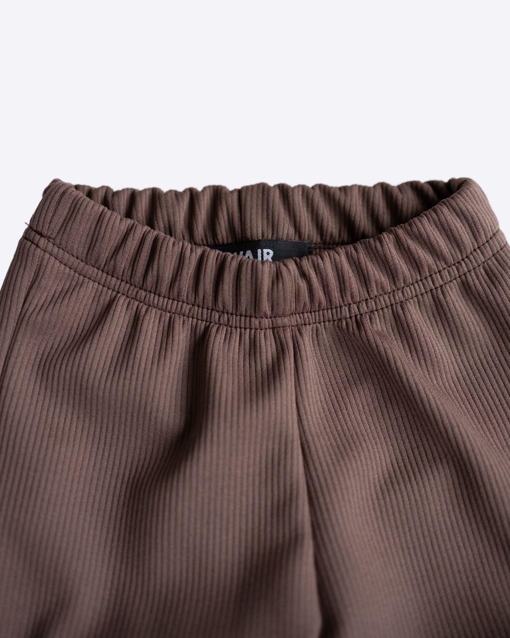 Close-up of elastic waistband on girls ribbed knit leggings Alwair Kids