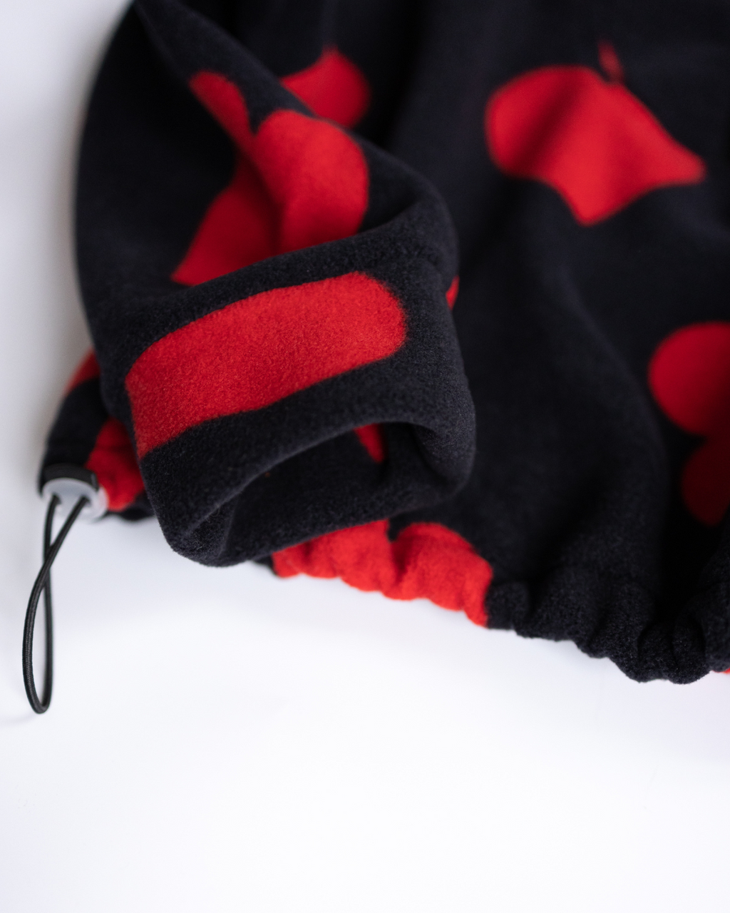 Elastic cuff and red heart print sleeve on girls fleece sweatshirt