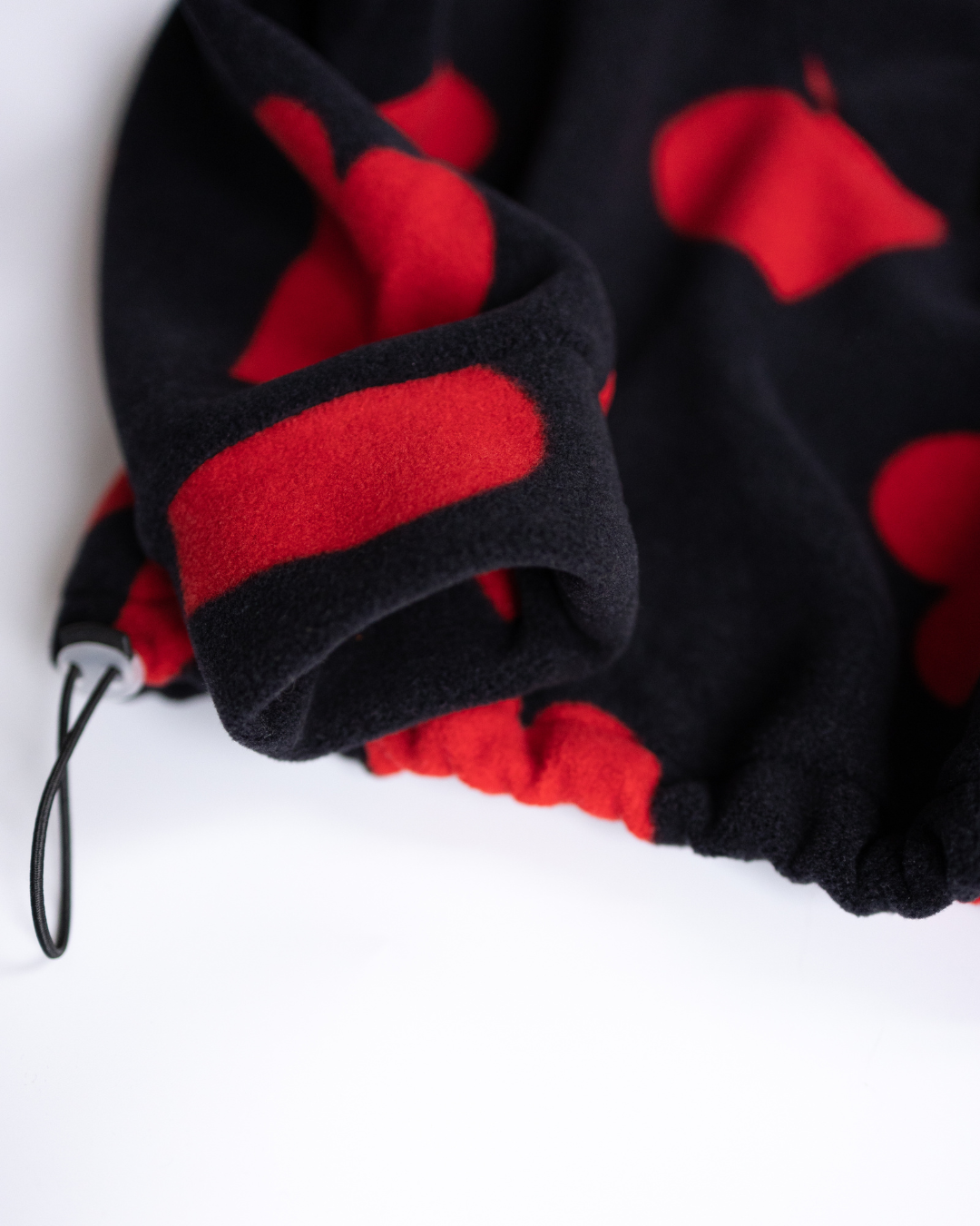 Elastic cuff and red heart print sleeve on girls fleece sweatshirt