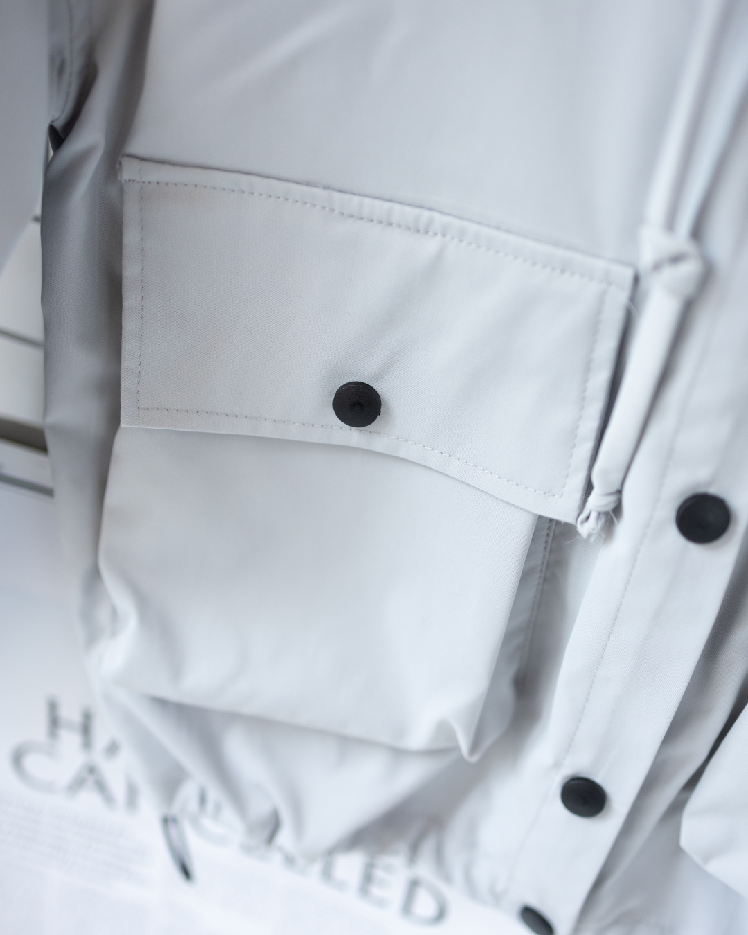 Large utility pocket on Alwair Kids windbreaker jacket