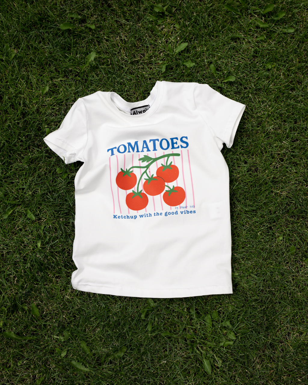 tomatoes graphic t-shirt for children on summer grass ketchup with the good vibes Alwair Kids