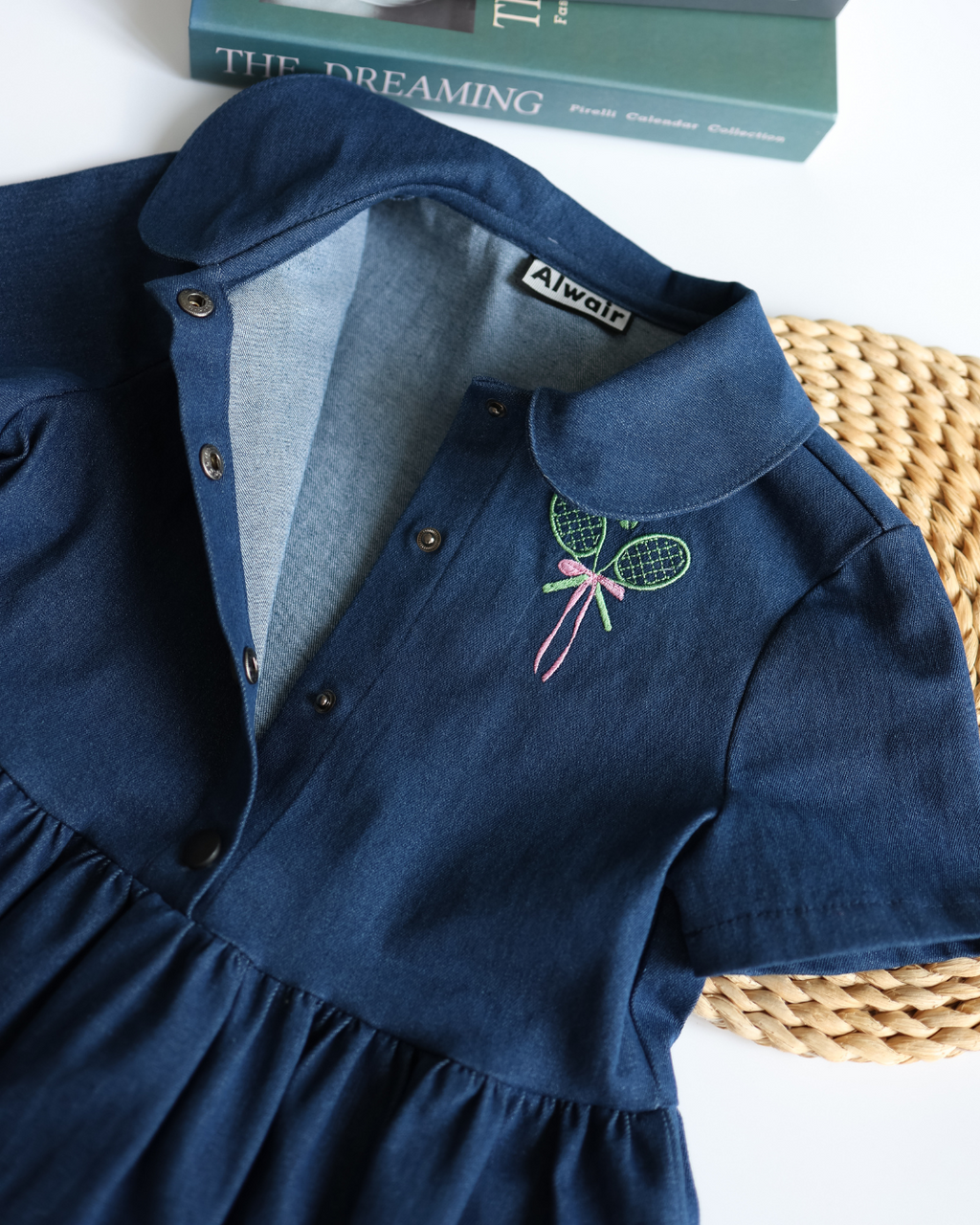 Inside view of Alwair Kids tennis dress showing buttons and lining
