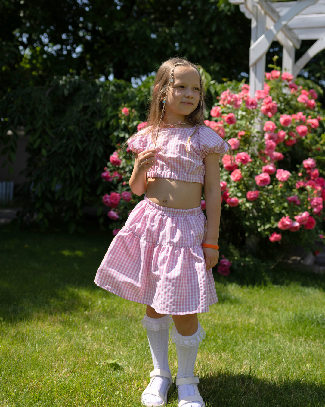 Girl wearing Blossom cotton set by Alwair Kids in a summer garden