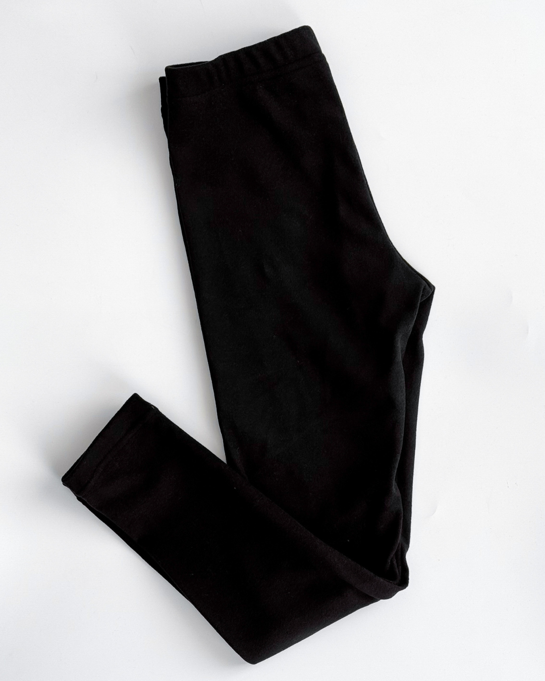 Black thermal leggings for kids by Alwair Kids flat lay