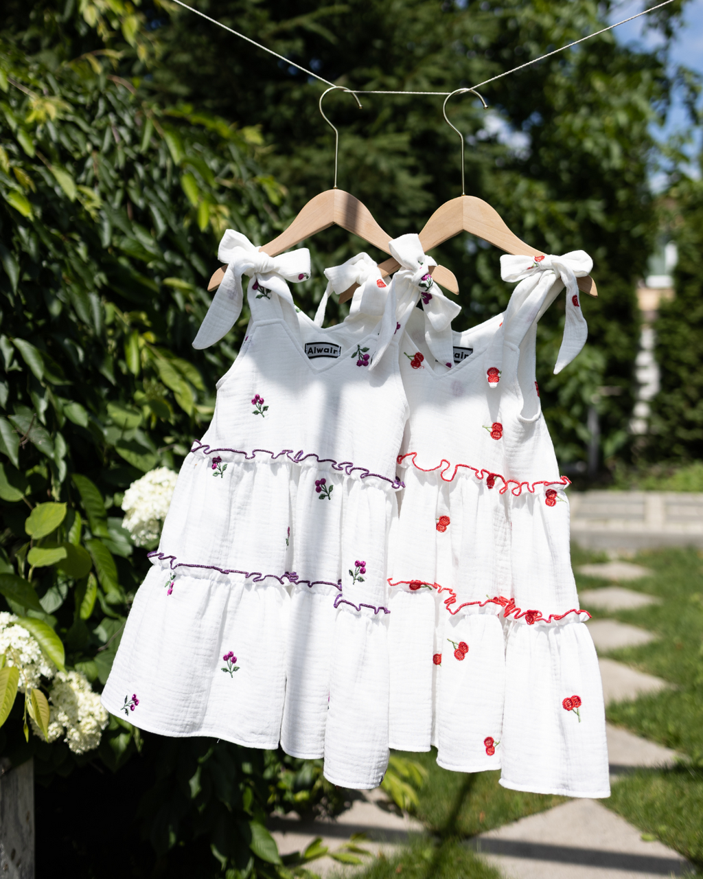 Girls summer dresses hanging outdoors in garden – Alwair Kids breathable muslin clothing

