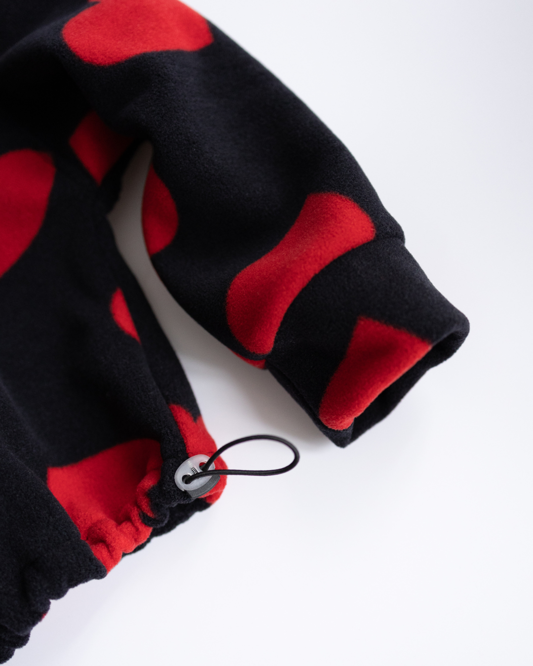 Drawstring hem close-up on fleece pullover for girls