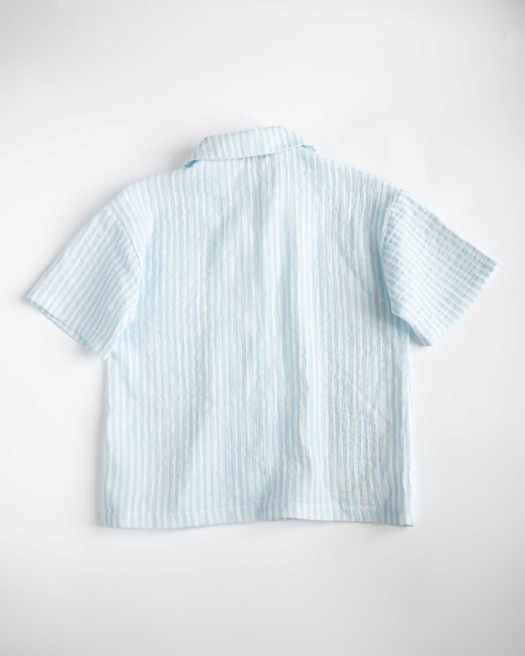 Back view of blue muslin shirt from Alwair Kids summer collection