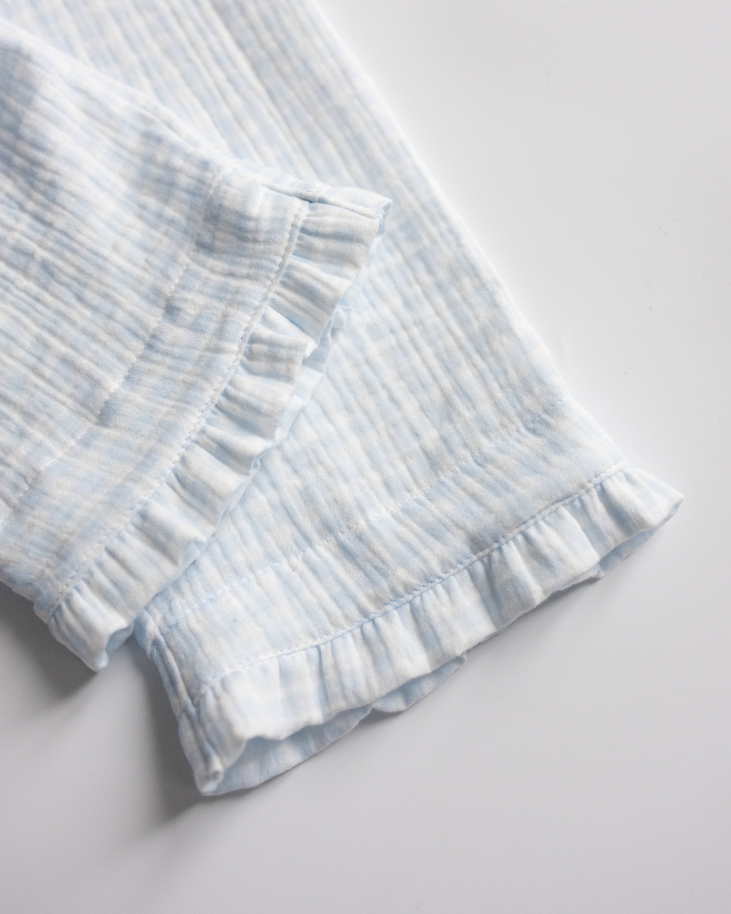 Ruffle hem on girls’ pajama pants in breathable blue muslin cotton