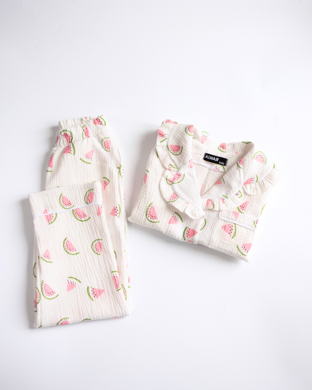 Folded muslin pajama set for girls with pink watermelon print and ruffle details