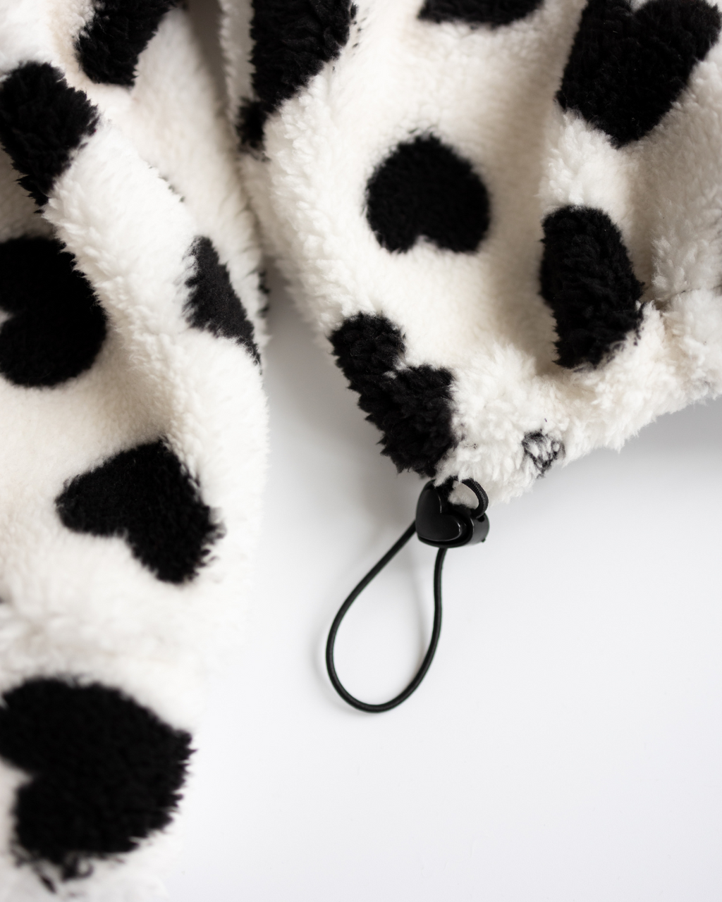 Elastic stopper detail on heart print pullover – Alwair Kids