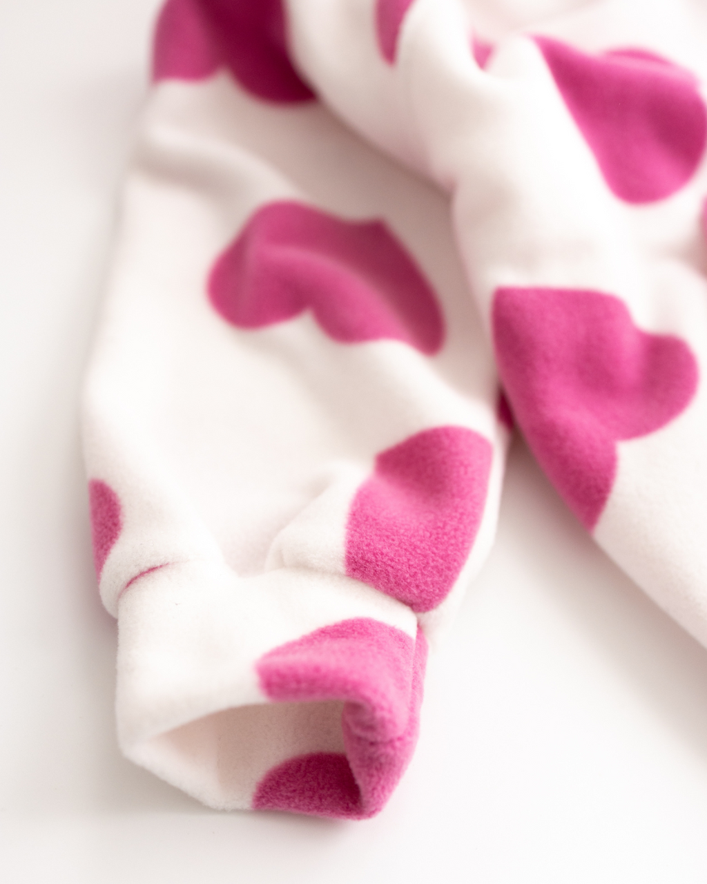 Close-up of elastic cuff on white fleece hoodie