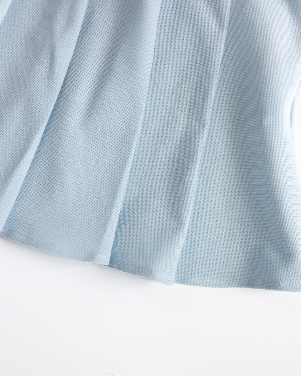 Macro texture of breathable lacoste fabric of skirt Alwair Kids