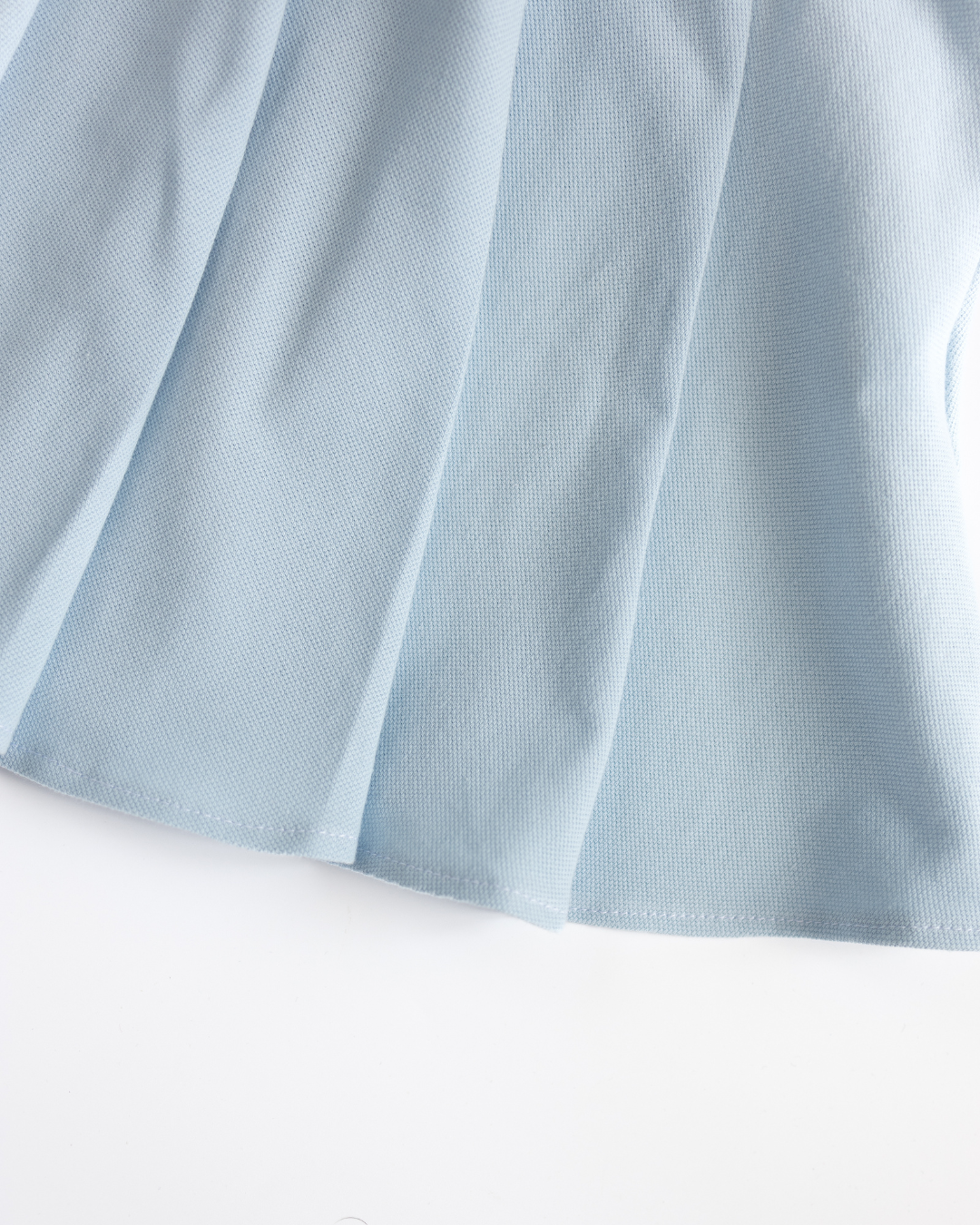 Macro texture of breathable lacoste fabric of skirt Alwair Kids
