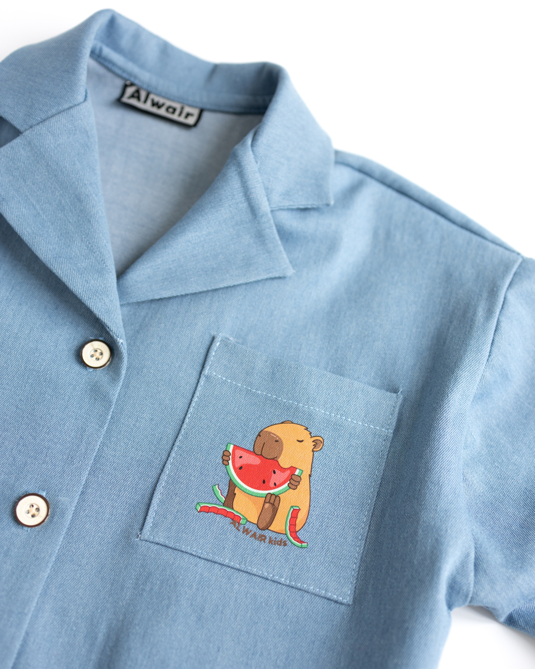 Close-up of capybara watermelon print on kids denim shirt pocket – Alwair Kids