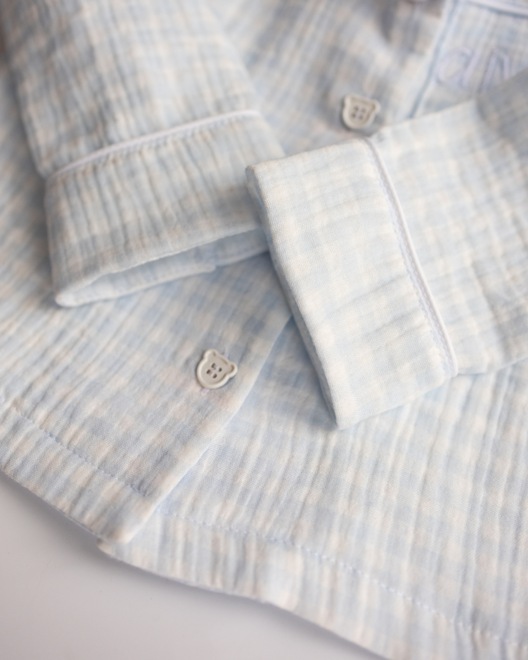 Detail of soft muslin fabric and shirt cuff with neat stitching – Alwair Kids