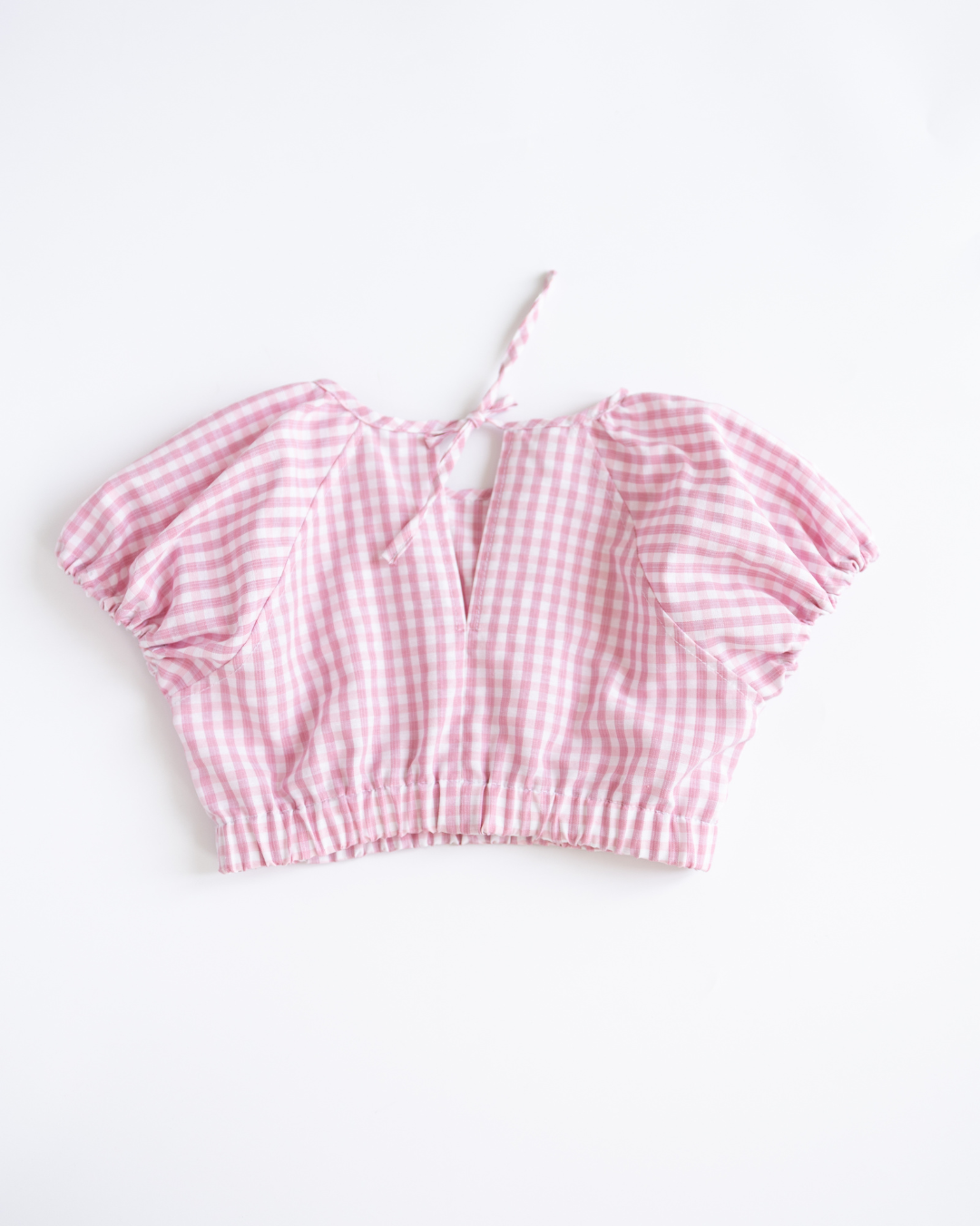 Back view of tie-neck pink gingham top from Blossom outfit Alwair Kids