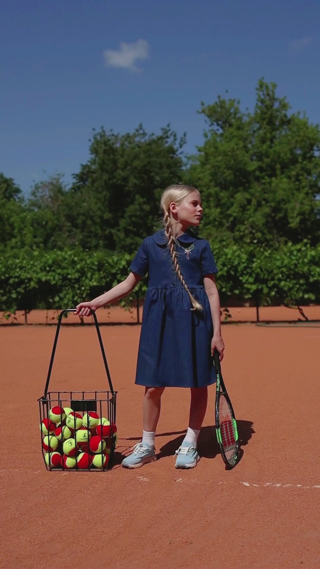 Girls' denim dress with embroidered tennis rackets and structured skirt from the Tennis Fun capsule by Alwair Kids – playful and stylish summer outfit.