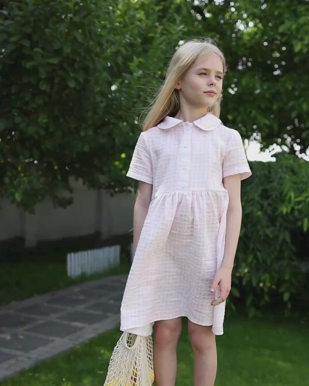 Girl in a soft muslin sundress by Alwair Kids – lightweight, breathable, with tie-shoulder straps and dreamy flow, perfect for warm-weather play