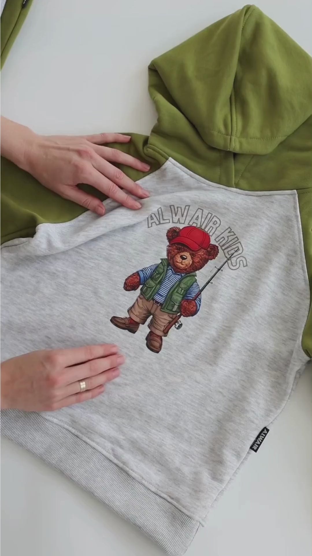 Alwair Kids cotton hoodie and joggers set for boys shown in motion with teddy bear print and soft ribbed cuffs in navy and green color options