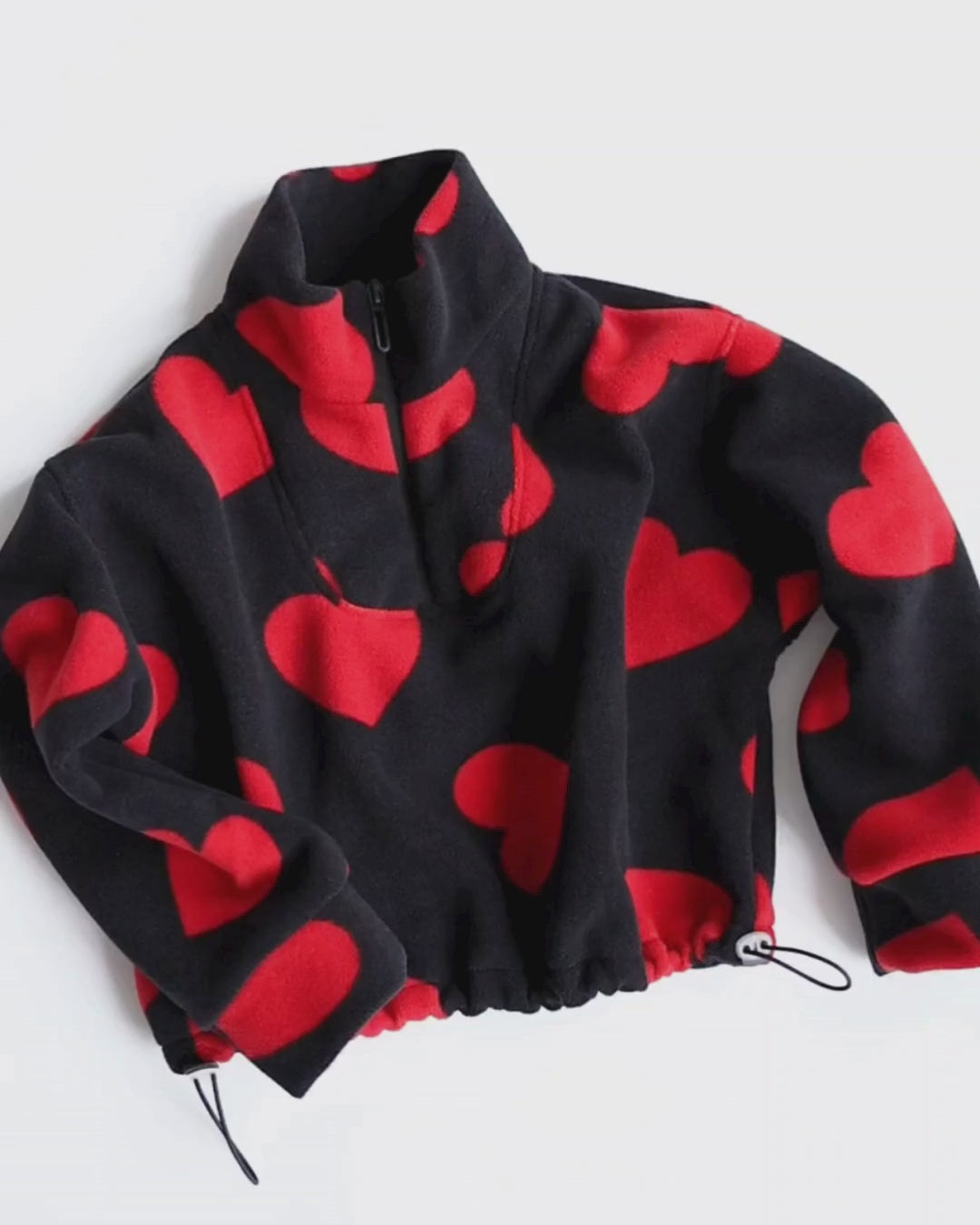 Video of heart fleece pullover for girls with zip and drawstring