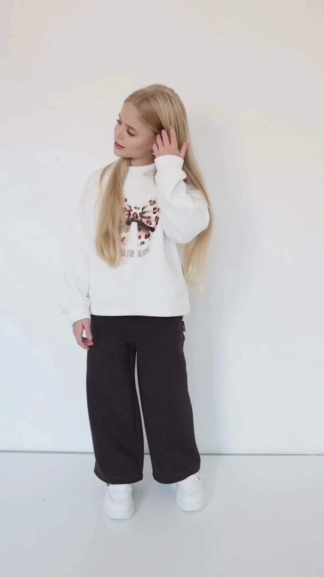 Child wearing relaxed-fit knit pants by Alwair Kids – soft fabric, comfortable fit, and versatile style for everyday wear.
