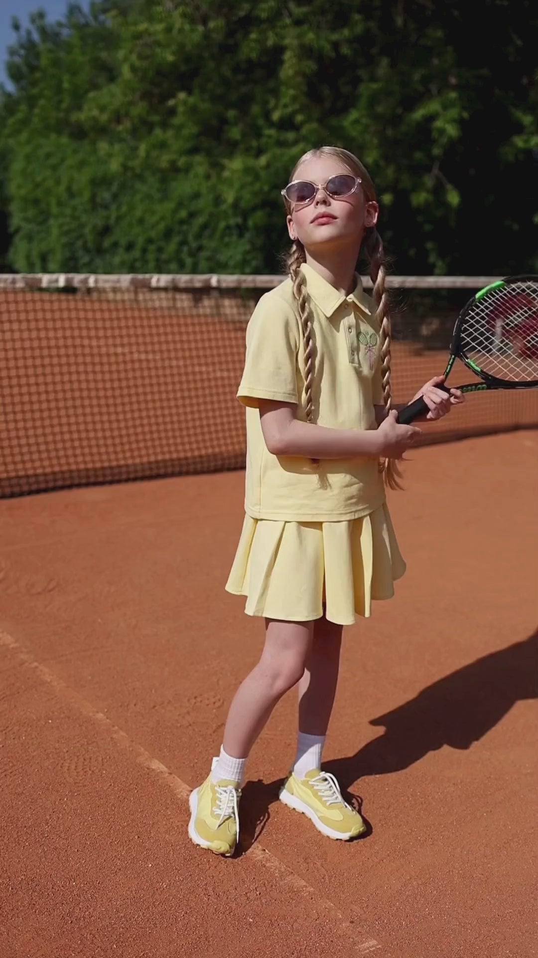 Kids' Lacoste polo shirt with embroidered tennis rackets and ball from the Tennis Fun capsule by Alwair Kids – sporty and breathable for summer play.