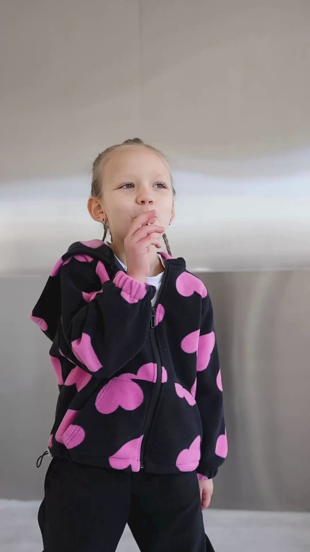 Video of girl modeling fleece zip hoodie with heart print by Alwair Kids

