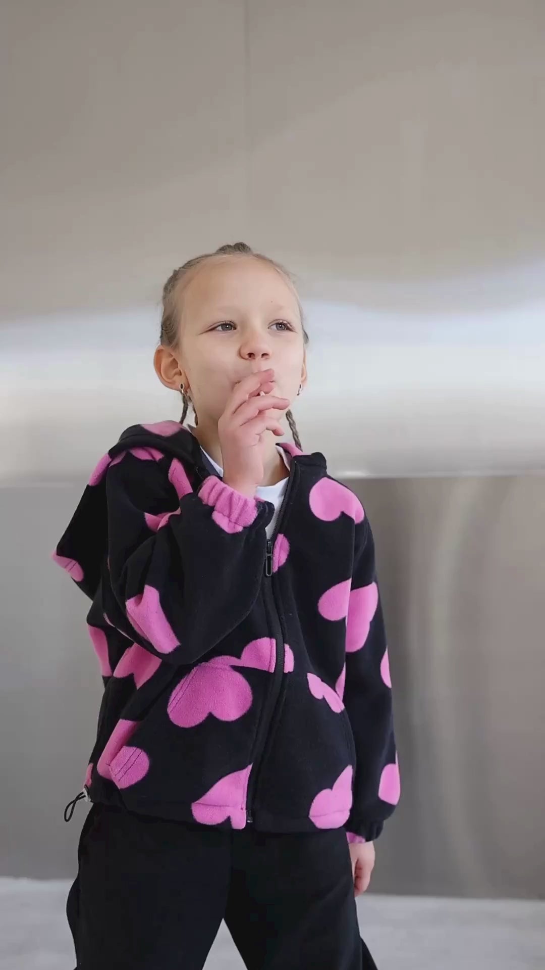 Video of girl modeling fleece zip hoodie with heart print by Alwair Kids

