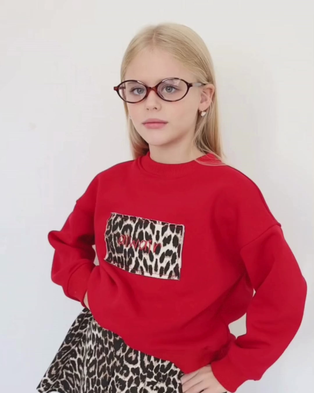 Child wearing a soft leopard-print sweatshirt by Alwair Kids, perfect for everyday adventures